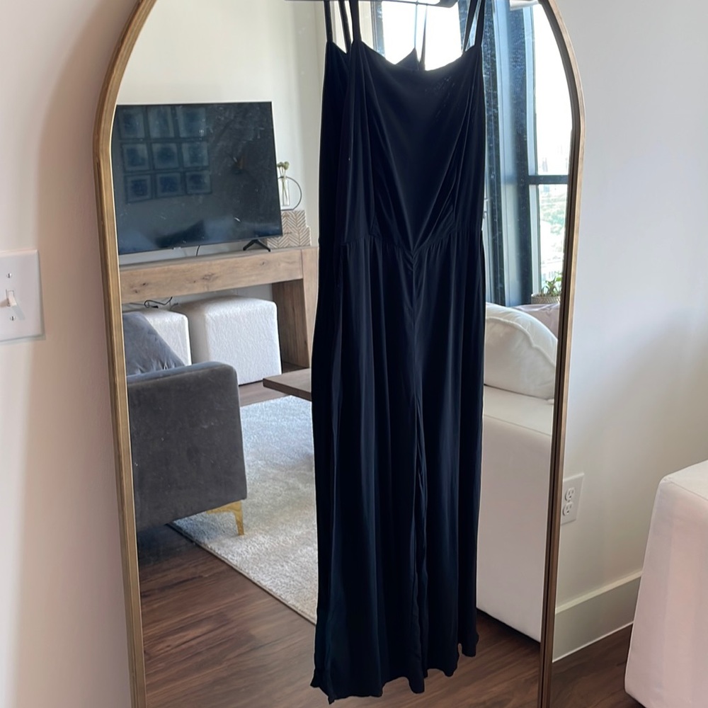 Black spaghetti strap jumpsuit with three-quarter leg pant. Lightweight flowy